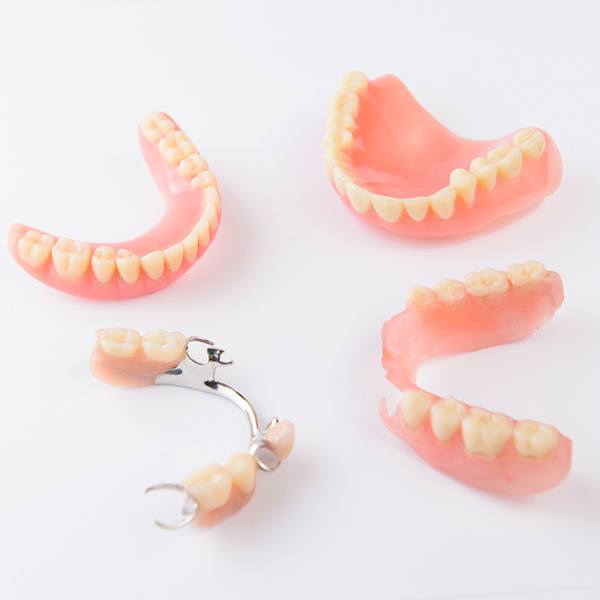Two full dentures and two partial dentures