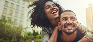 Woman embracing a man from behind