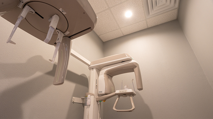 Dental scanning machine standing against a white wall