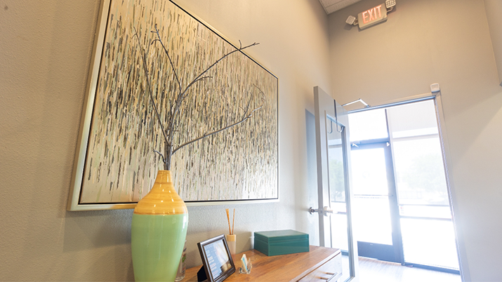 Abstract wall art just inside the entrance to the dental office